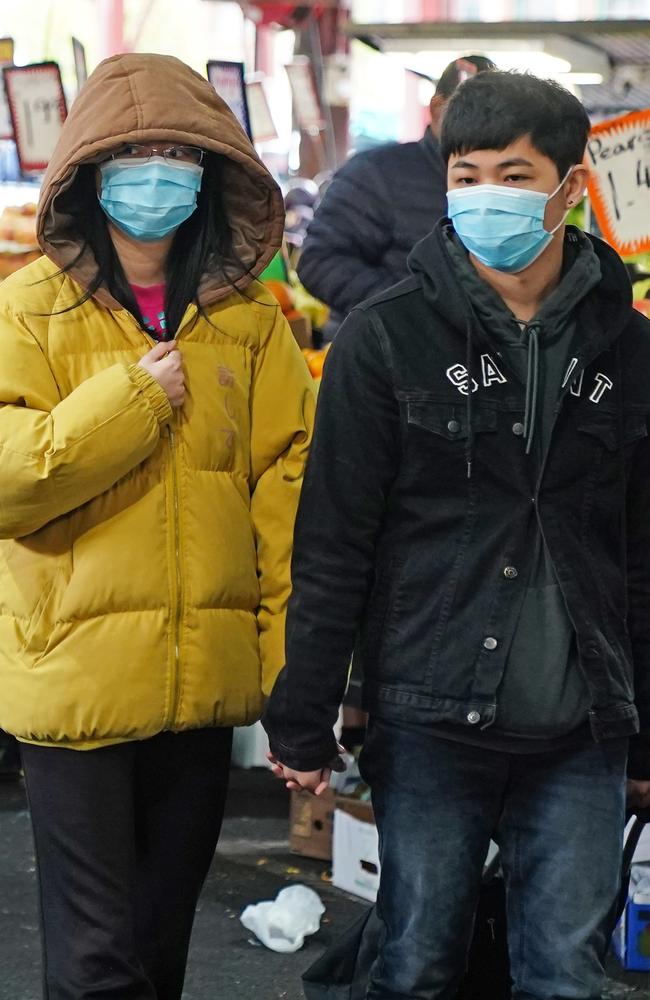 People shop at the Queen Victoria Market while wearing face masks as a preventive measure against the spread of novel coronavirus COVID-19 in Melbourne, Saturday, April 11, 2020. Picture: Scott Barbour