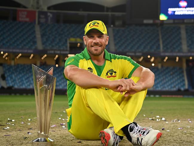 DUBAI, UNITED ARAB EMIRATES - NOVEMBER 14: Australia captain Aaron Finch poses with the ICC T20 World Cup after the ICC Men's T20 World Cup final match between New Zealand and Australia at Dubai International Cricket Stadium on November 14, 2021 in Dubai, United Arab Emirates. (Photo by Gareth Copley-ICC/ICC via Getty Images)