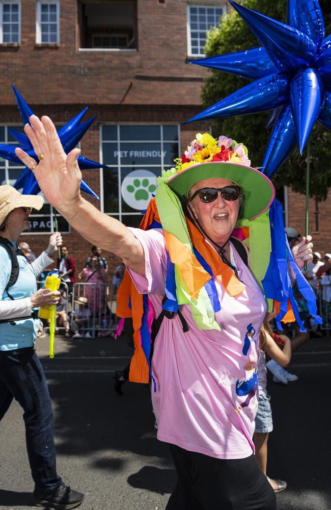 Ann Best marches with the St Vincent's de Paul Society float in the Grand Central Floral Parade of the Carnival of Flowers, Saturday, September 21, 2024. Picture: Kevin Farmer