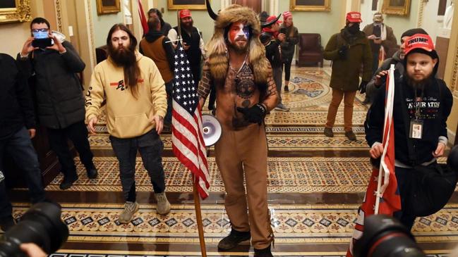 Donald Trump supporters enter the US Capitol as Congress debated the 2020 presidential election Electorial vote Certification. Picture: AFP