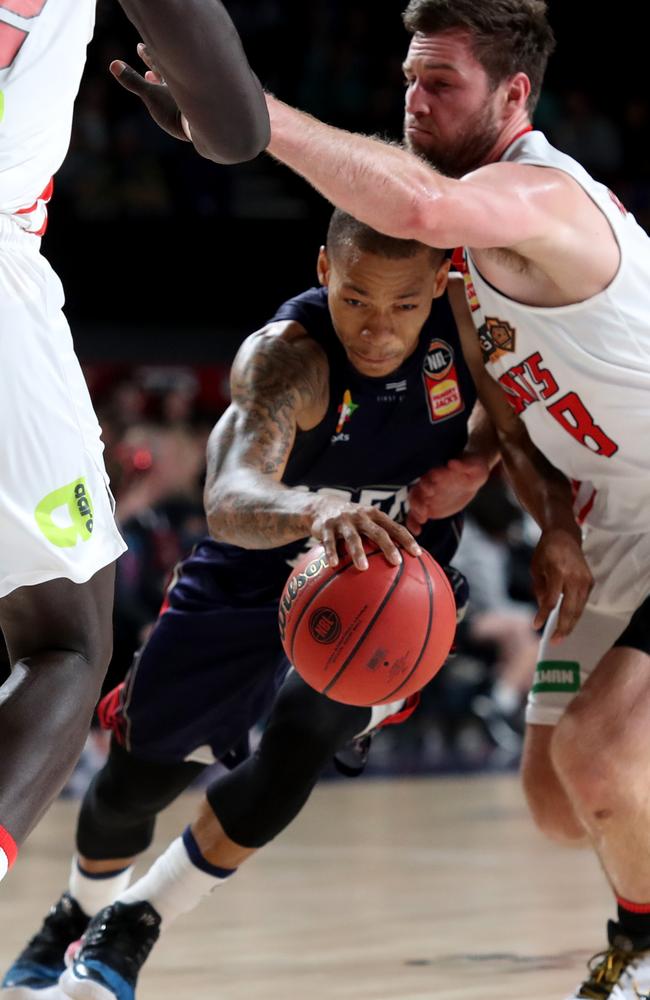 Jerome Randle taking on Mitch Norton on Friday night. Picture: Kelly Barnes (AAP).