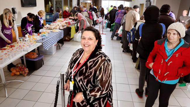 Salvation Army's Madeliene Scicluna at the Salvos’ headquarters in Pirie Street as people file through to collect food. Picture: AAP / Dean Martin