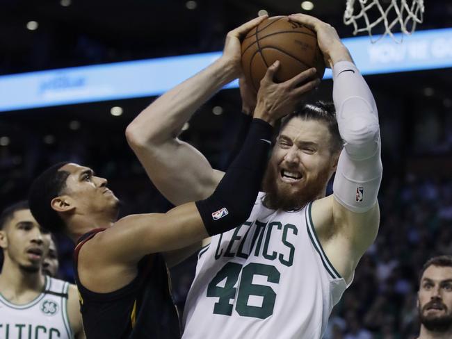 Boston Celtics center Aron Baynes (46) competes for a rebound against Cleveland Cavaliers guard Jordan Clarkson during the second quarter of Game 5 of the NBA basketball Eastern Conference finals Wednesday, May 23, 2018, in Boston. (AP Photo/Charles Krupa)