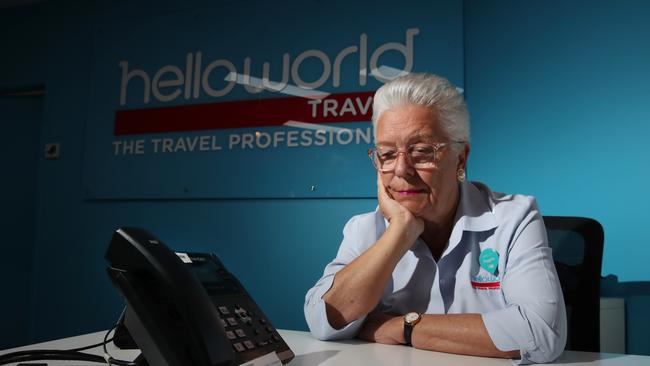 Manager Andrea Cole waits for phone inquiries at the Helloworld Mudgeeraba office. Picture Glenn Hampson