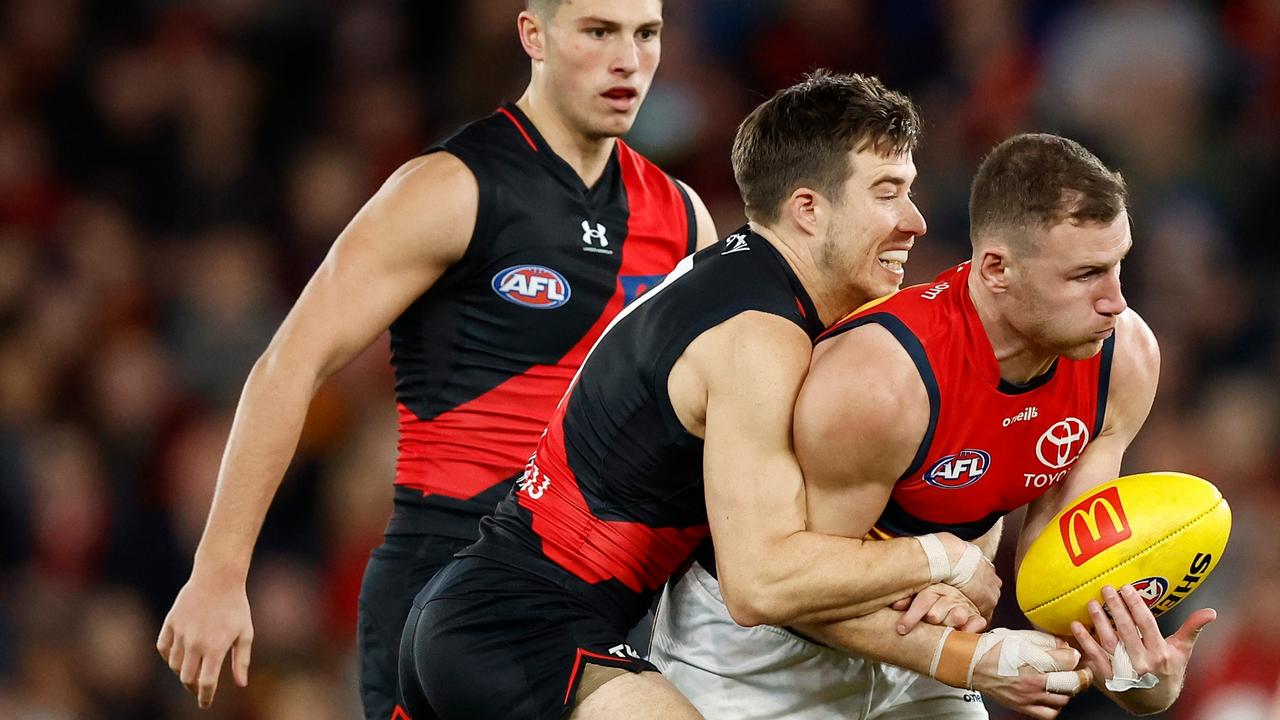 Essendon star Zach Merrett tackles Crow Rory Laird. Picture: Michael Willson/AFL Photos