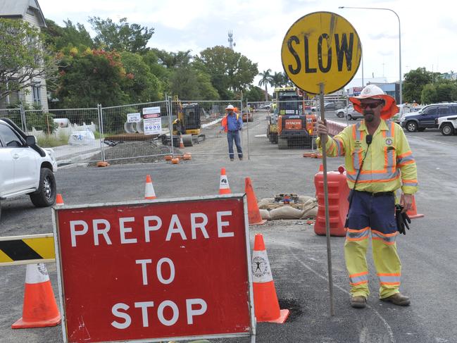 Jerry Dawes from Workforce Road Services controls traffic flow as construction take place for the Clarence Valley's first traffic lights at the intersection of Pound and Clarence streets as part of the new Grafton bridge build.