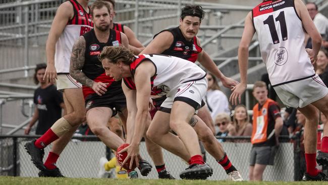 Riley Cousins gathers the ball for Panton Hill. Picture: Valeriu Campan