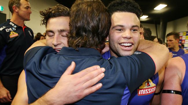 Luke Beveridge hugs Luke Dahlhaus and Jason Johannisen. Picture: Michael Klein