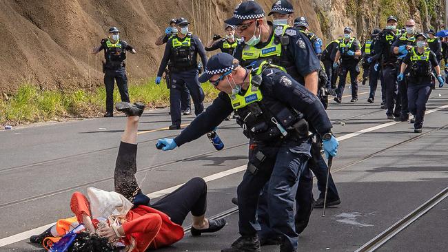 A protester is pepper sprayed by police. Picture: Jason Edwards