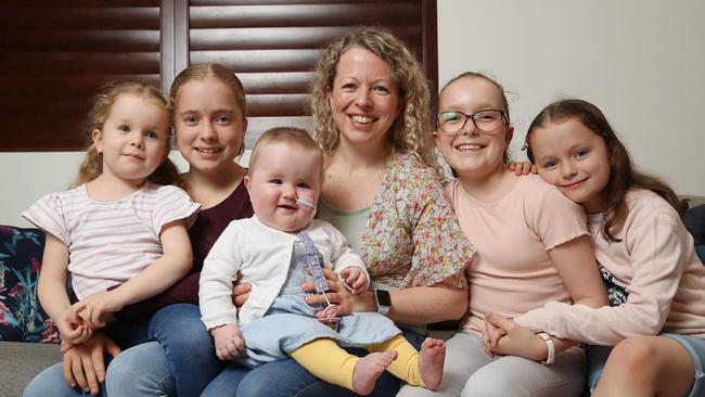 Christie Rea with Imogen (on her lap) and her four other daughters (from left) Catya, Mischa, Breanna and Summer 9. Picture: David Swift