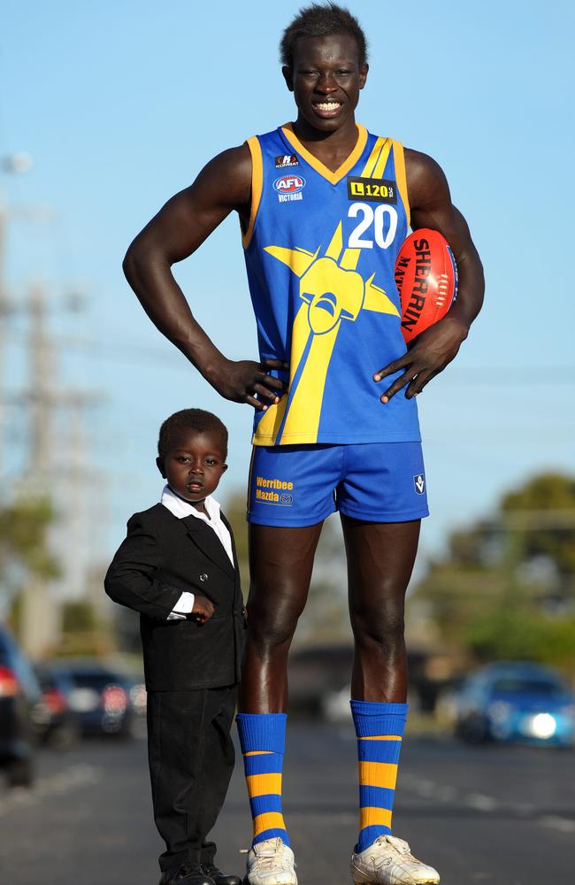 Majak Daw at 18, with his youngest brother Ajak, then three. He says his family struggled to understand why he would attempt to take his own life. Picture: News Corp