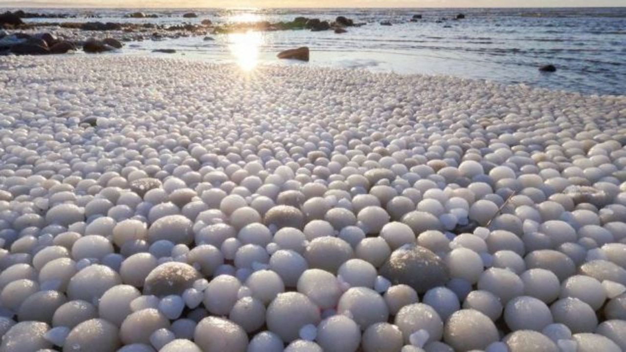 The extraordinary sight of a beach full of ice eggs was captured on Hailuoto Island in Finland. Picture: Risto Mattila