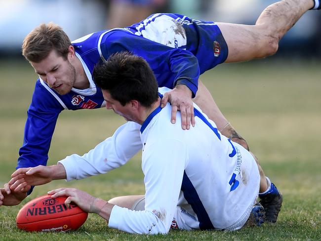 Coburg Districts’ Matthew Vesnaver battles for possession with Sunbury Kangaroos’ Daniel Gregory. Picture: Andy Brownbill