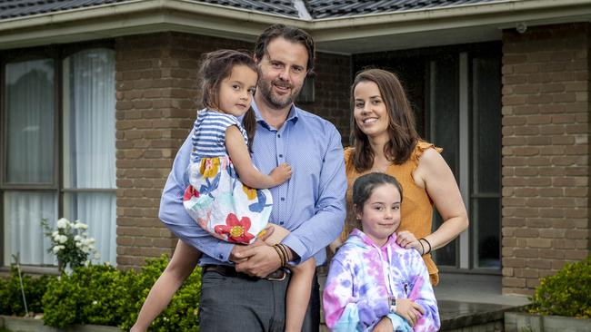 Chris Downer, 42, wife Lauren, 37, and two children Evie, 7, and Isla, 4, are hoping their bank passes on the RBA's cash rate cut. Picture: Jake Nowakowski.