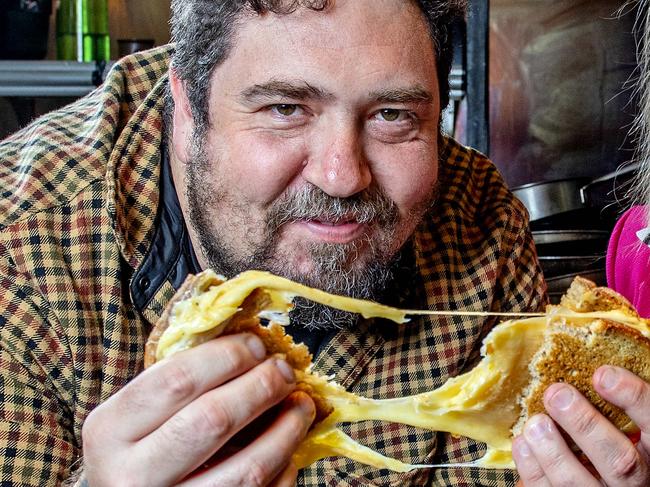 Duncan Welgemoed  and Kris Lloyd AM (CheeseFest Event Director) try a Cheese Toastie at Africola Monday,October,23,2023.Picture Mark Brake