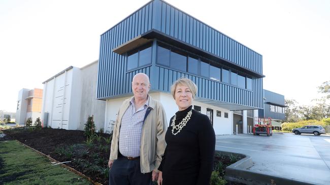 Bill Barry-Cotter and Leonie Smith in front of the virtually complete 'prestige' industrial units at Coomera. Photo by Richard Gosling