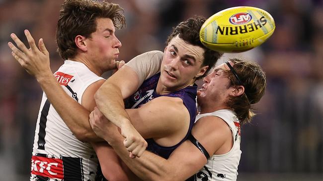 Clark is tackled by Patrick Lipinski and Harvey Harrison in Round 11. Picture: Paul Kane/Getty Images.