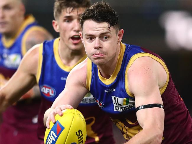 BRISBANE, AUSTRALIA - JUNE 24: Lachie Neale of the Lions runs the ball during the round 14 AFL match between the Brisbane Lions and the Geelong Cats at The Gabba on June 24, 2021 in Brisbane, Australia. (Photo by Chris Hyde/AFL Photos/via Getty Images)