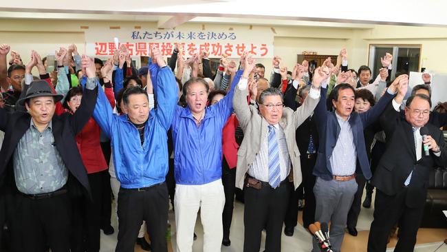 Okinawa activists celebrate the results of the referendum. Picture: AFP