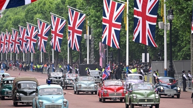 Modern and vintage cars throughout the 70 years of the Queen was also paraded to show how much has changed in that time. Picture: Karwai Tang/WireImage