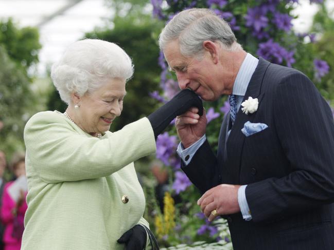 The Queen presents her son with the Royal Horticultural Society's Victoria Medal of Honour during a visit to the Chelsea Flower Show in 2009. Picture: Getty Images