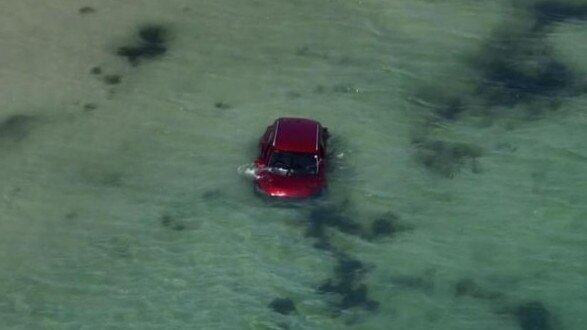 The red vehicle of the alleged murder victim was found in the ocean off Cervantes in WA. Picture: 7 NEWS