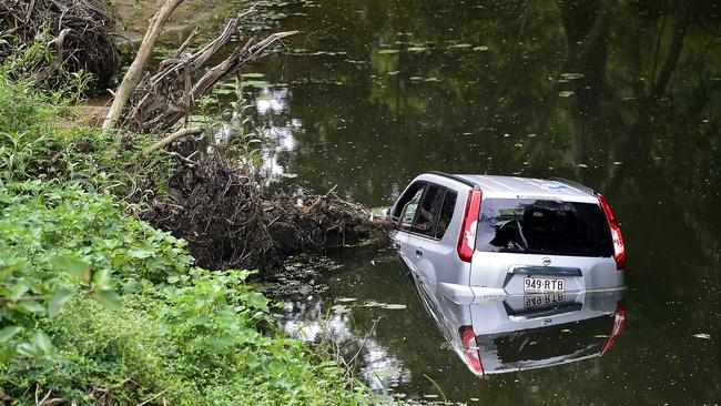 A stolen car dumped in the Bohle River near the Dalrymple Rd overpass. Picture: Matt Taylor.