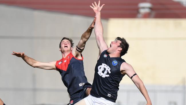 Joel Carter flies against Josh Marchbank. Picture: Nathan McNeil