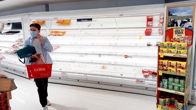 Empty shelves at a Coles supermarket in inner Melbourne in January this year. Picture: Andrew Henshaw