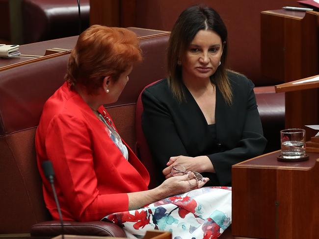 Senator Pauline Hanson talking with Senator Jacqui Lambie after her speech on the medevac bill. Picture Kym Smith