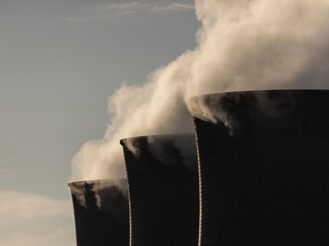 (FILES) A general view of cooling towers at the Grootvlei Power Station, a coal-fired power plant operated by Eskom located in in Grootvlei on December 18, 2022. South Africa's President Cyril Ramaphosa said on February 8, 2024 that the end to crippling power cuts that have badly damaged the economy was "within reach", as he delivered a state of the nation address ahead of general elections later this year. (Photo by GUILLEM SARTORIO / AFP)