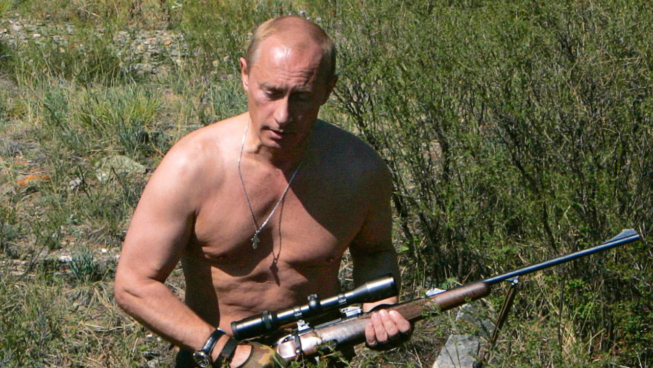 Russian politician President Vladimir Putin carrying a hunting rifle in the Republic of Tuva.