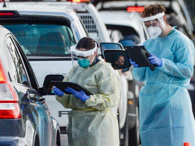 ADELAIDE, AUSTRALIA - NewsWire Photos JULY 01, 2021 -  Lines of cars and health workers at the Victoria Park Covid testing clinic in Adelaide. Picture: NCA NewsWire / Brenton Edwards