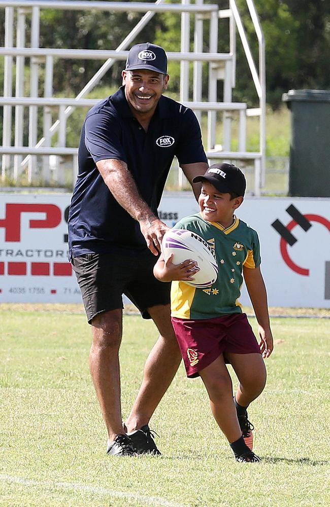 Maybe this is where Martin learnt the dark arts of dummy half. Former Broncos skipper and NRL star Justin Hodges, enjoys a run with Tristian Martin (9) at a junior development clinic, Jones Park, Cairns, in February 2017. PICTURE: JUSTIN BRIERTY