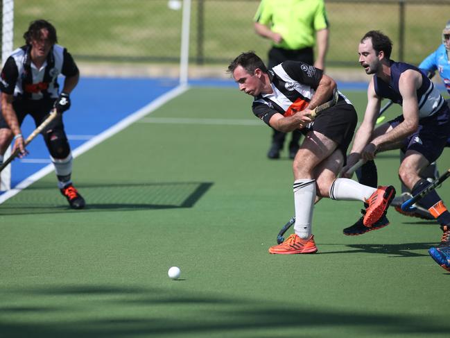 Hockey SA Premier League - Mens game, Port Adelaide v Forrestville. PortÃs Daniel Haynes clears the ball ahead of ForrestvilleÃs Jaykay Young. 20 March 2021. Picture Dean Martin