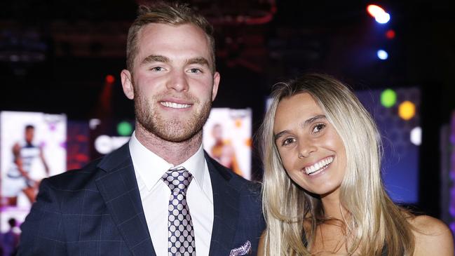 Tom Mitchell of the Hawks and partner Hannah Davis pose for a photo with the Leigh Matthews Trophy during the AFL Players' MVP Awards in Melbourne, Thursday, August 30, 2018. (AAP Image/Daniel Pockett) NO ARCHIVING, EDITORIAL USE ONLY