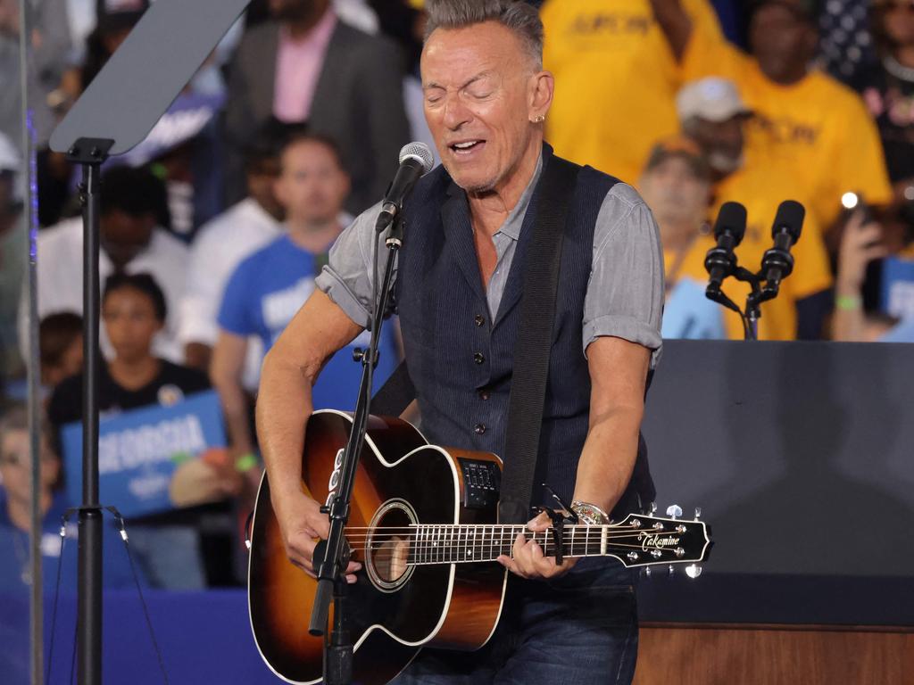 CLARKSTON, GEORGIA - OCTOBER 24: Musician Bruce Springsteen performs during a campaign event for Democratic presidential nominee, U.S. Vice President Kamala Harris with former President Barack Obama at the James R Hallford Stadium on October 24, 2024 in Clarkston, Georgia. Harris and Republican presidential nominee, former U.S. President Donald Trump, continue campaigning in battleground swing states before the November 5th election. Alex Wong/Getty Images/AFP (Photo by ALEX WONG / GETTY IMAGES NORTH AMERICA / Getty Images via AFP)