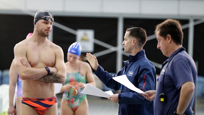 Olympian Kyle Chalmers in discussion with his coaches. Picture: Sarah Reed