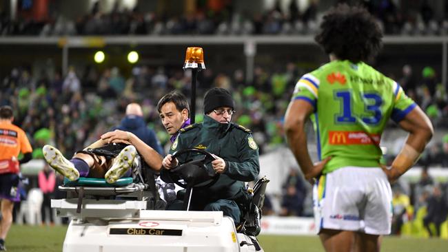 Sia Soliola watches Billy Slater being stretchered off the field. Picture: AAP