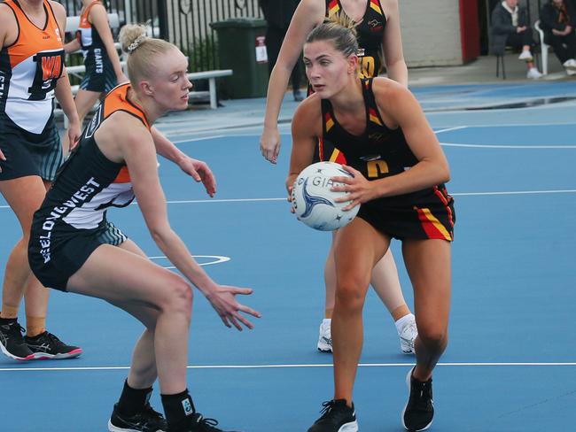 St Joseph's Elli Leydin (C) tries to find a way passed Giants Nikita Handley (C). Geelong West Giants v St Joseph's A Grade netball at West Oval. Picture: Alan Barber