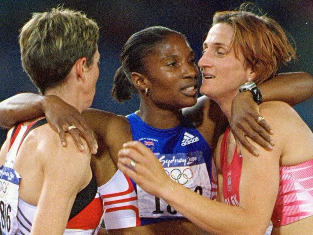 24 Sep 2000:  Fellow competitors congratulate Heptathlon Gold Medal winner Denise Lewis of Great Britain after the 800m Heptathlon discipline at the Olympic Stadium on Day Nine of the Sydney 2000 Olympic Games in Sydney, Australia. \ Mandatory Credit: StuForster /Allsport