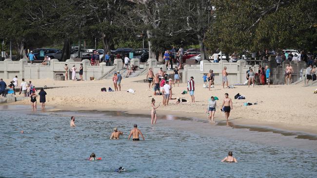 A beautiful sunny day this morning at Balmoral Beach in Mosman, an inner-harbour beach which has remained open. Picture: David Swift