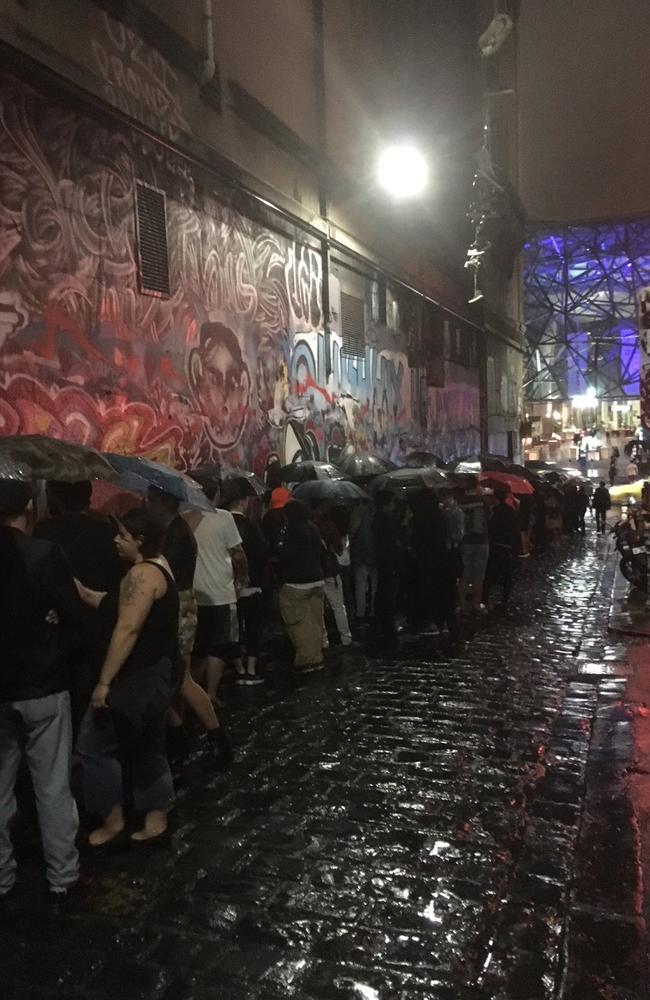 Diehard fans brave the rain for the Madonna concert. Picture: Cameron Adams / Twitter
