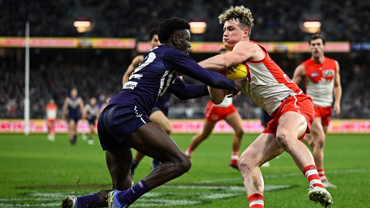 Chad Warner, pictured fending off Docker Michael Frederick, has added toughness to the Swans’ midfield. Picture: Getty Images