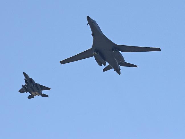 U.S. Air Force B-1B bomber, centre, and a South Korean fighter jet F-15K fly over the Seoul Airport where a site for the 2017 Seoul International Aerospace and Defence Exhibition. Picture: Yonhap via AP