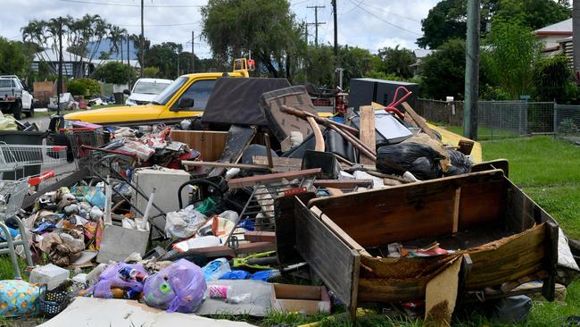 Rural firefighters from southern Queensland, SA and NSW help clean up. Davidson Street. Picture: Evan Morgan