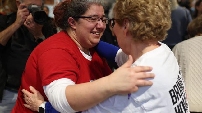 Friends of Israeli hostage Yair Horn celebrate after watching the sixth hostage-prisoner swap on a screen in Kfar Saba. Picture: AFP