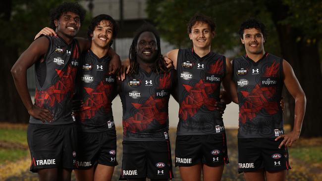 DO NOT USE BEFORE CONTACTING HERALDSUN PIC DESKÃ.MELBOURNE. 18/05/2023.  AFL .   EssendonÃs indigenous players L-R. Anthony Munkara , Alwyn Davey jnr , Anthony McDonald-Tipungwuti ,  Tex Wanganeen and Jayden Davey of the Bombers before Dreamtime at the G  .  Pic: Michael Klein