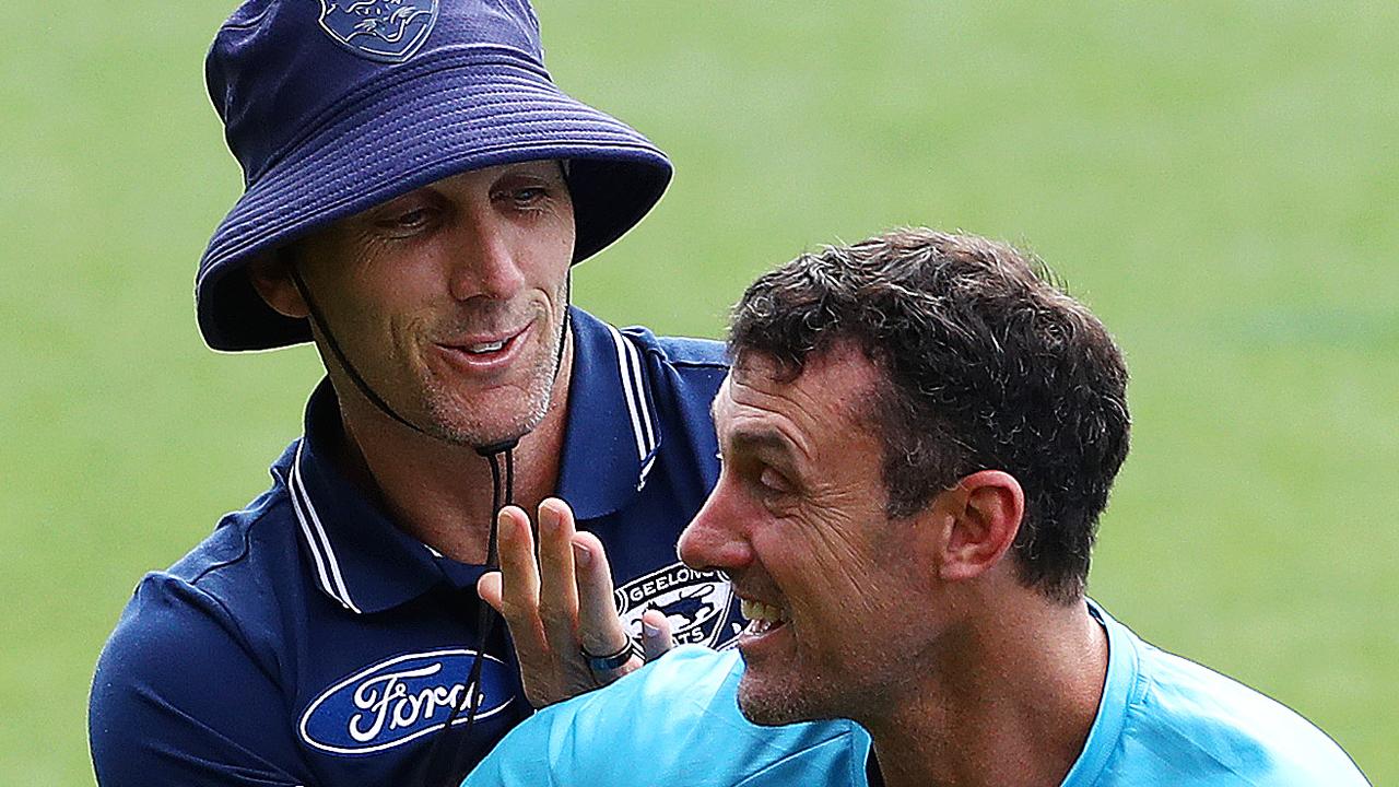 Harry Taylor tussles with Nigel Lappin at Geelong Cats training. Picture: Alison Wynd