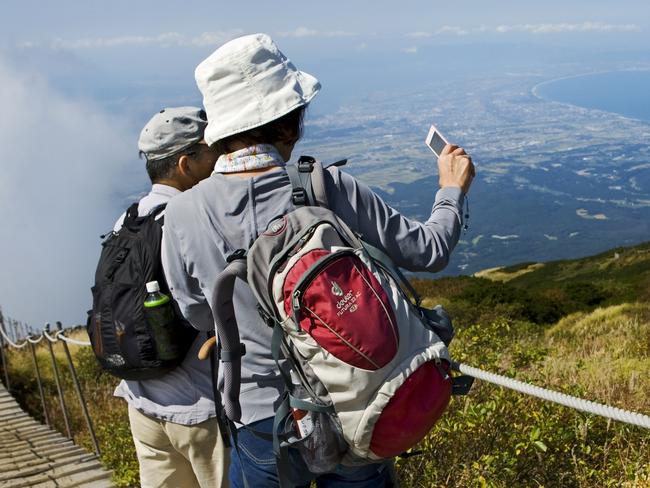 ESCAPE, RACHEL LEES, JAPAN'S NATURAL WONDERSPICTURE: ISTOCKMt. Daisen, Japan - September 29, 2015: Japanese mature couple is hiking and taking pictures in the scenery around the mount Daisen volcano. The mount Daisen walk is one of the most popular day-trip destinations for tourists in the japanese mountains of the main island Honshu.